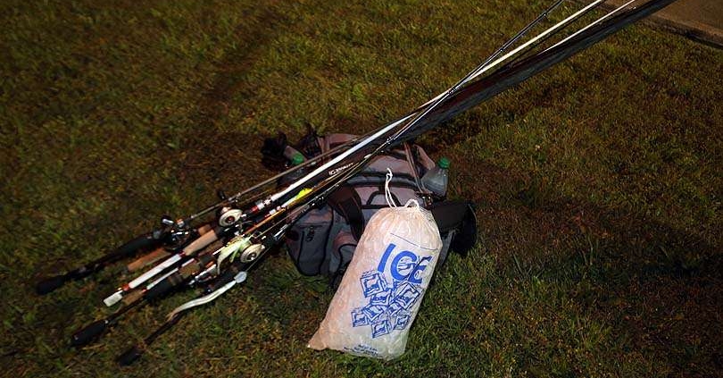 Rod and reels, tackle bag and a bag of ice